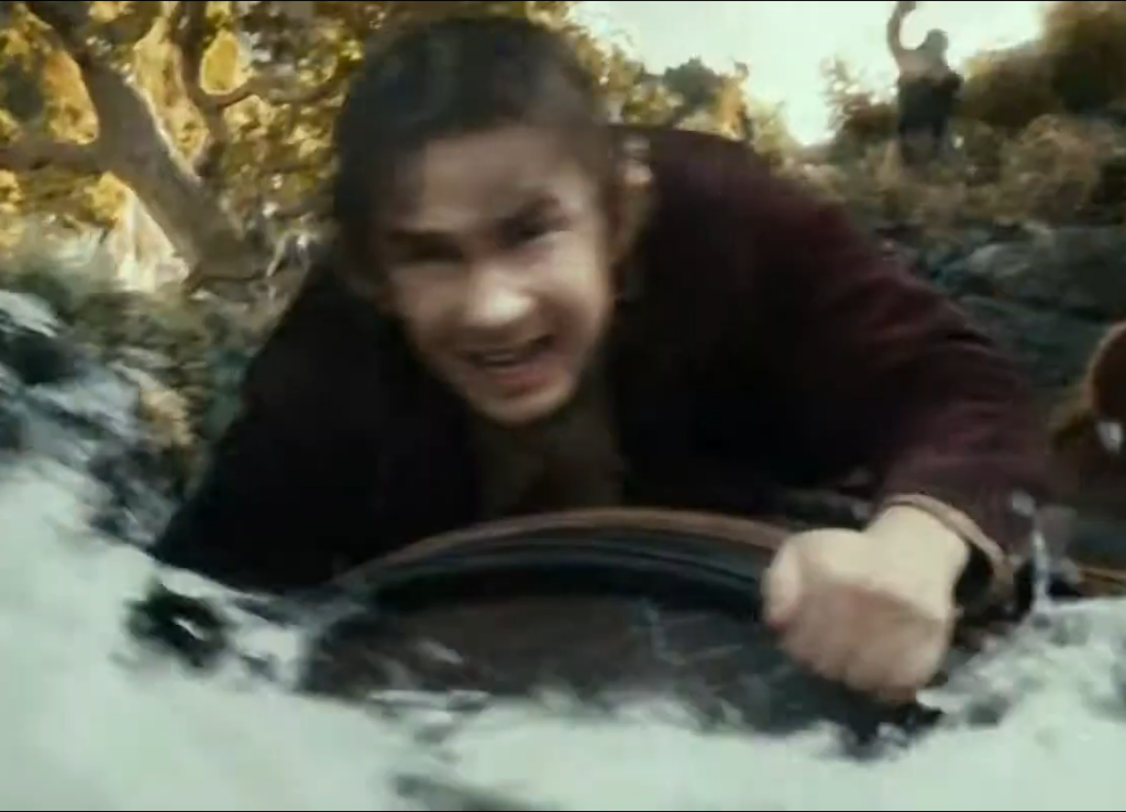 Bilbo Baggins riding a barrel
